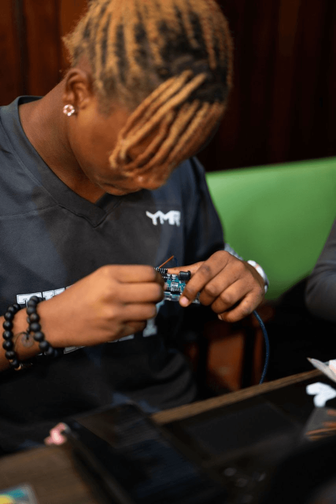 Hardware engineering — Esabu Blessing working on a PCB